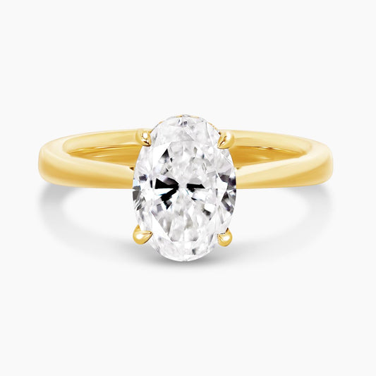 18ct yellow gold oval diamond ring in a four claw setting with hidden halo