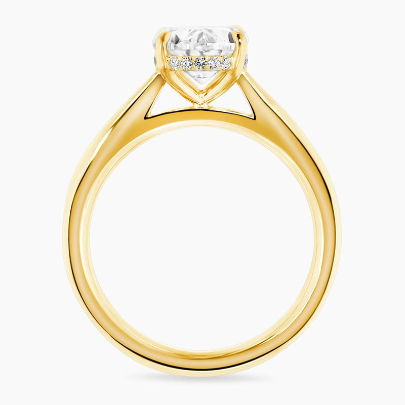 18ct yellow gold oval diamond ring in a four claw setting with hidden halo side profile
