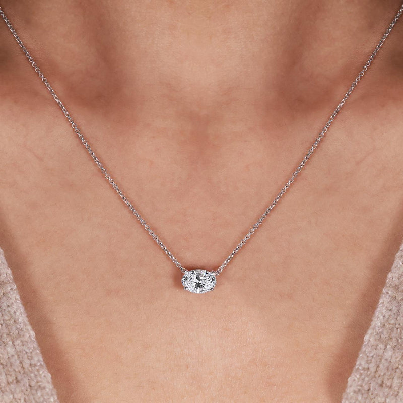 18ct white gold LAB Grown oval brilliant cut diamond necklace in a claw setting displayed on the neck