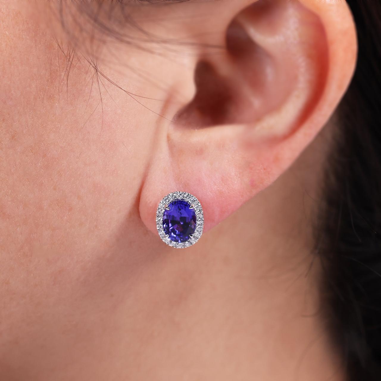 18ct white gold oval shape tanzanite and diamond stud earrings on ear