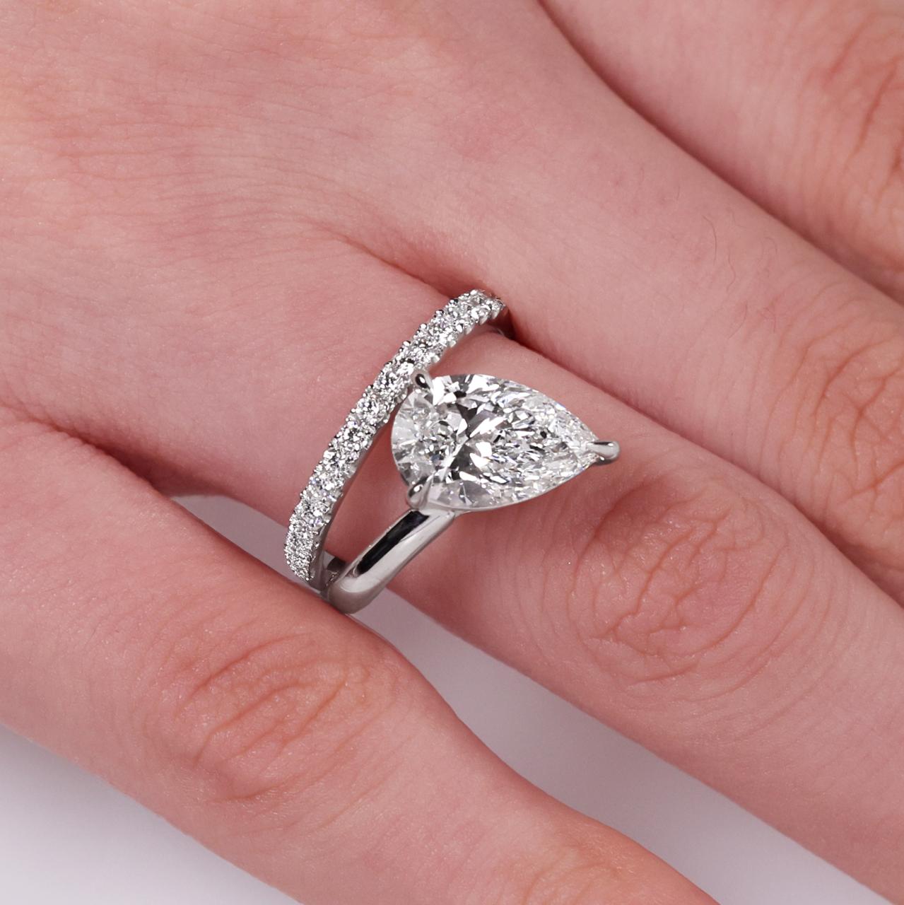 18ct white gold 2.51ct pear and round brilliant cut lab grown diamond ring on finger