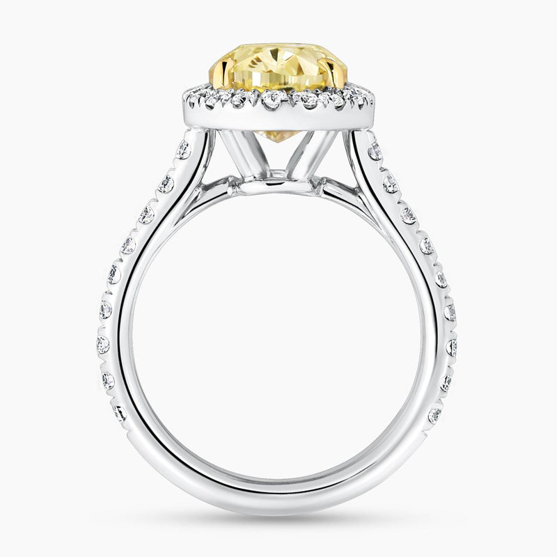 18ct white and yellow gold fancy yellow oval cut and white diamond halo engagement ring side profile