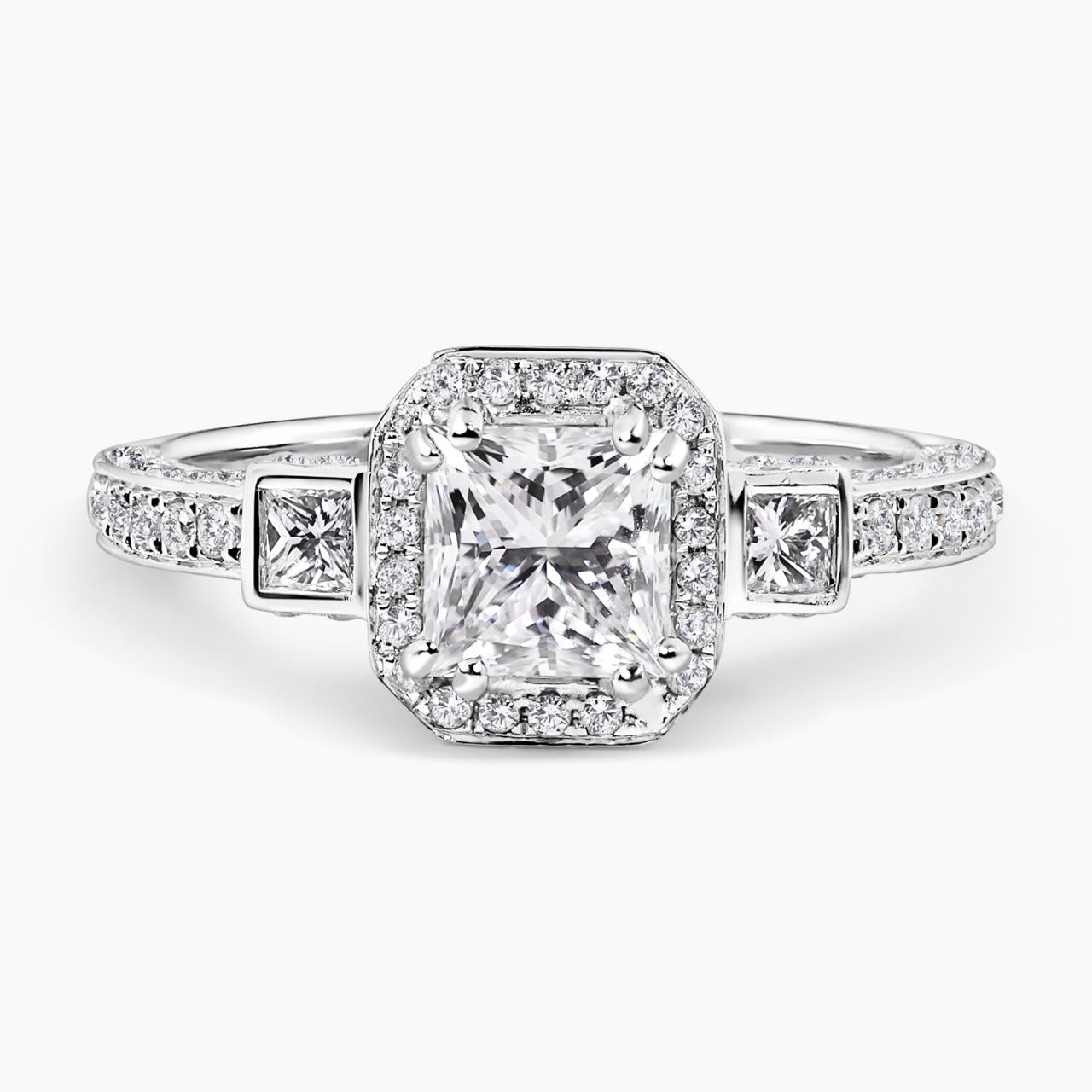 18ct white gold 1.00ct and 2=0.14ct princess cut diamond bezel set halo three stone ring