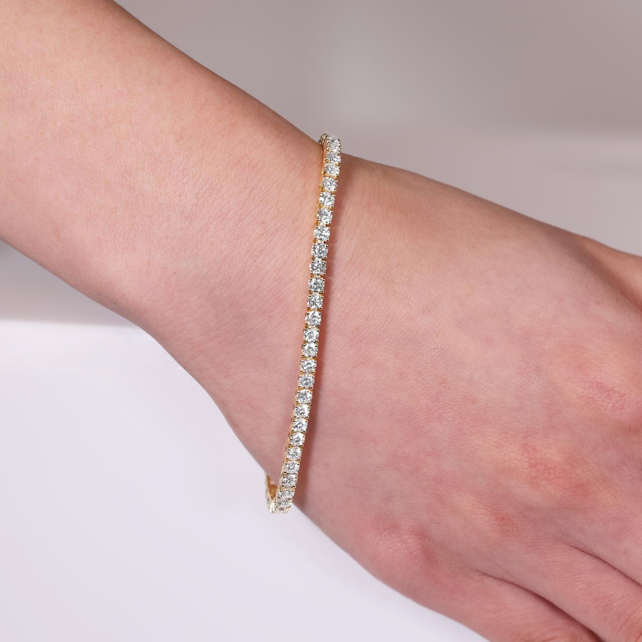 18ct yellow gold  57=5.78ct DEF VVS VS round brilliant cut lab grown diamonds tennis bracelet in a four claw setting