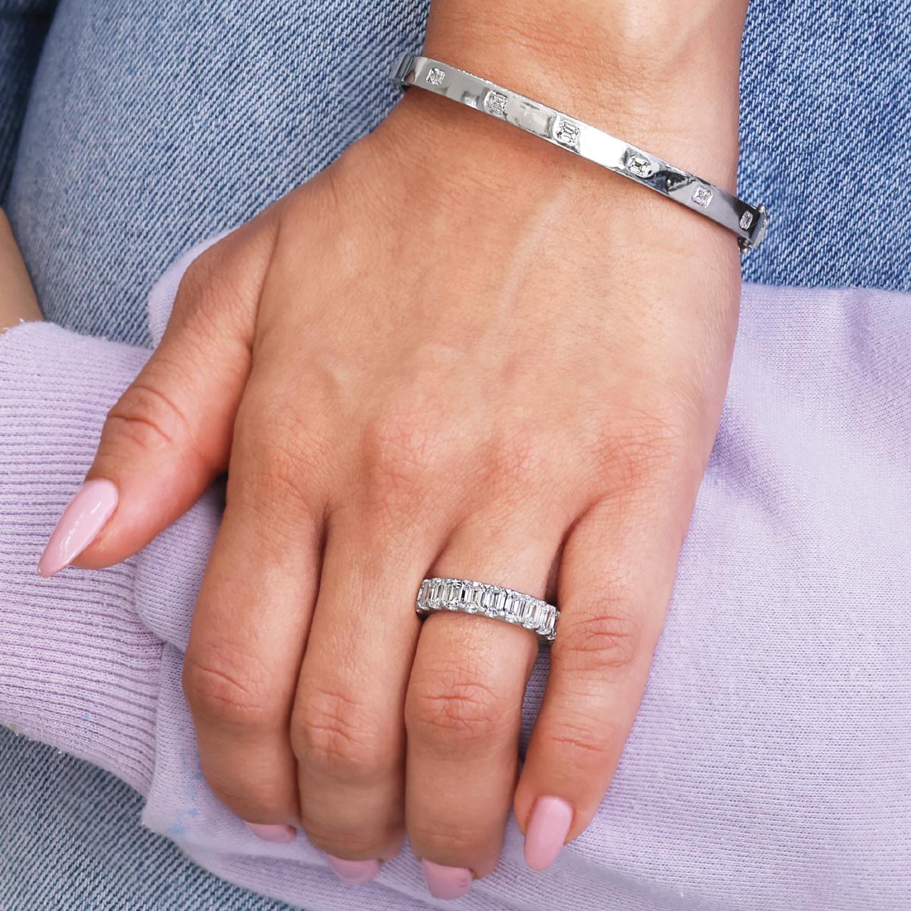 18ct white gold Emerald cut diamonds full circle ring in a claw setting on the finger