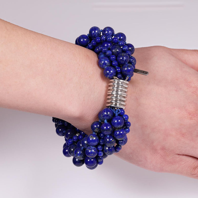 Blue lapis beads and silver cubic zirconia rondels bracelet ended with a silver ribbed magnetic clasp from the Carmela Cerrone Collection on wrist