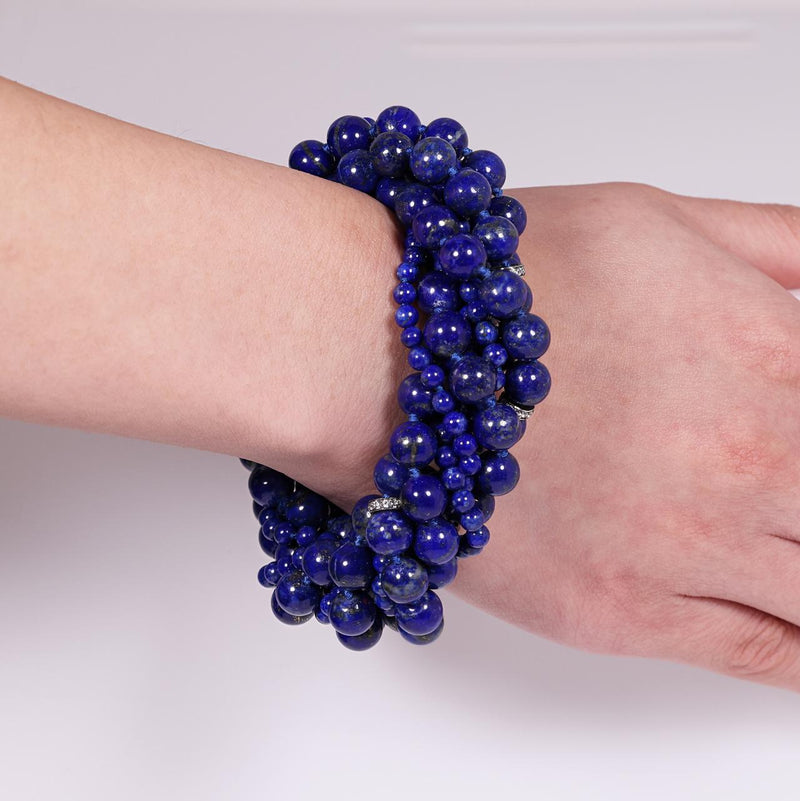 Blue lapis beads and silver cubic zirconia rondels bracelet ended with a silver ribbed magnetic clasp from the Carmela Cerrone Collection on wrist
