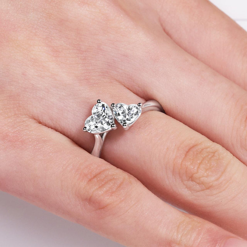 18ct white gold two heart shape diamonds ring on finger