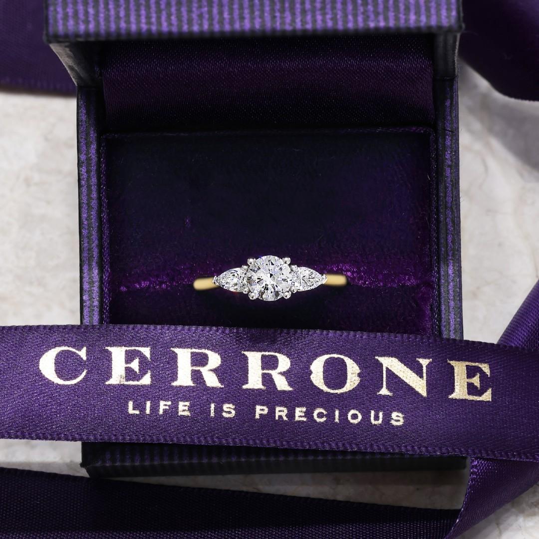 18ct yellow and white gold round brilliant cut and pear shaped diamond engagement ring 
