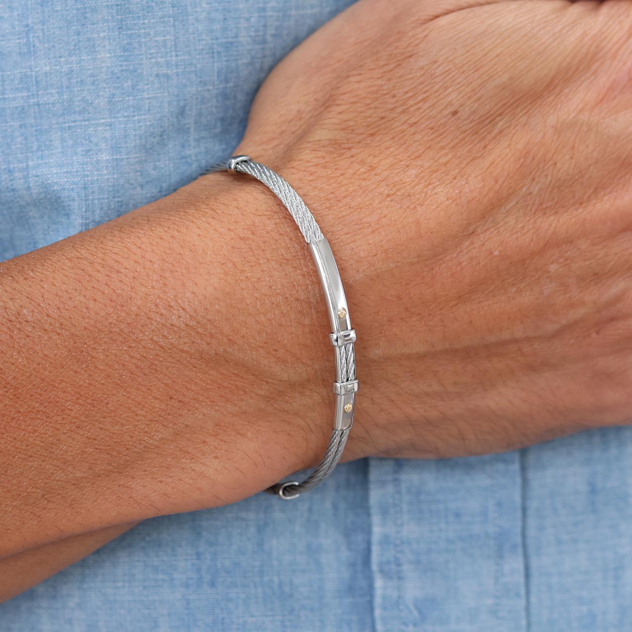 Stainless steel (white) and 18ct yellow gold men's bracelet on the wrist