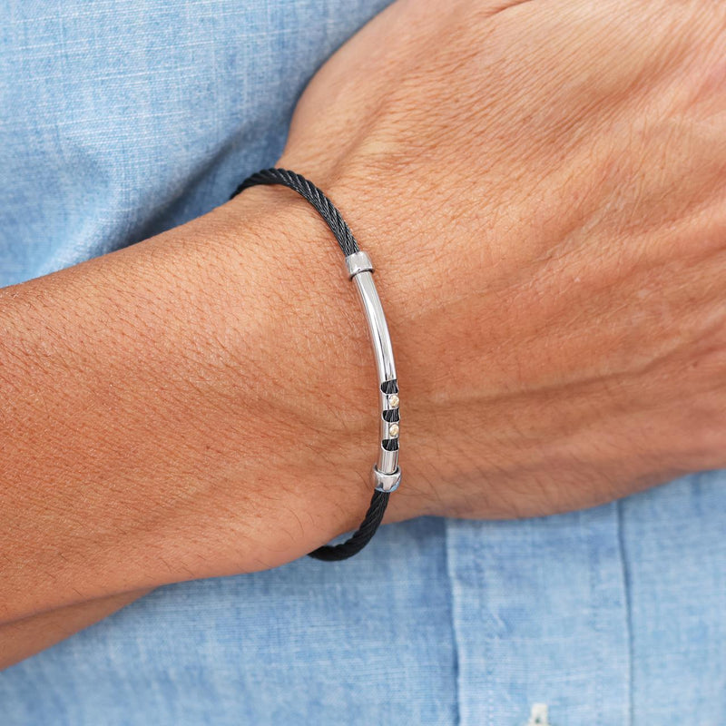 Stainless steel (black) and 18ct yellow gold men's bracelet on the wrist