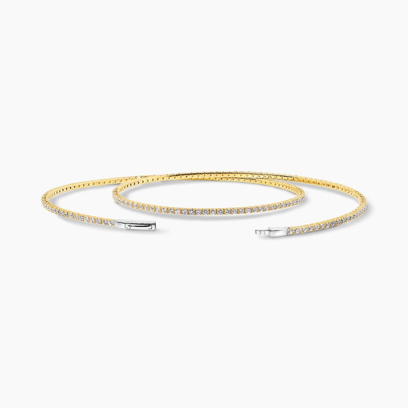 18ct yellow and white gold double layered diamond claw set bangle on the wrist