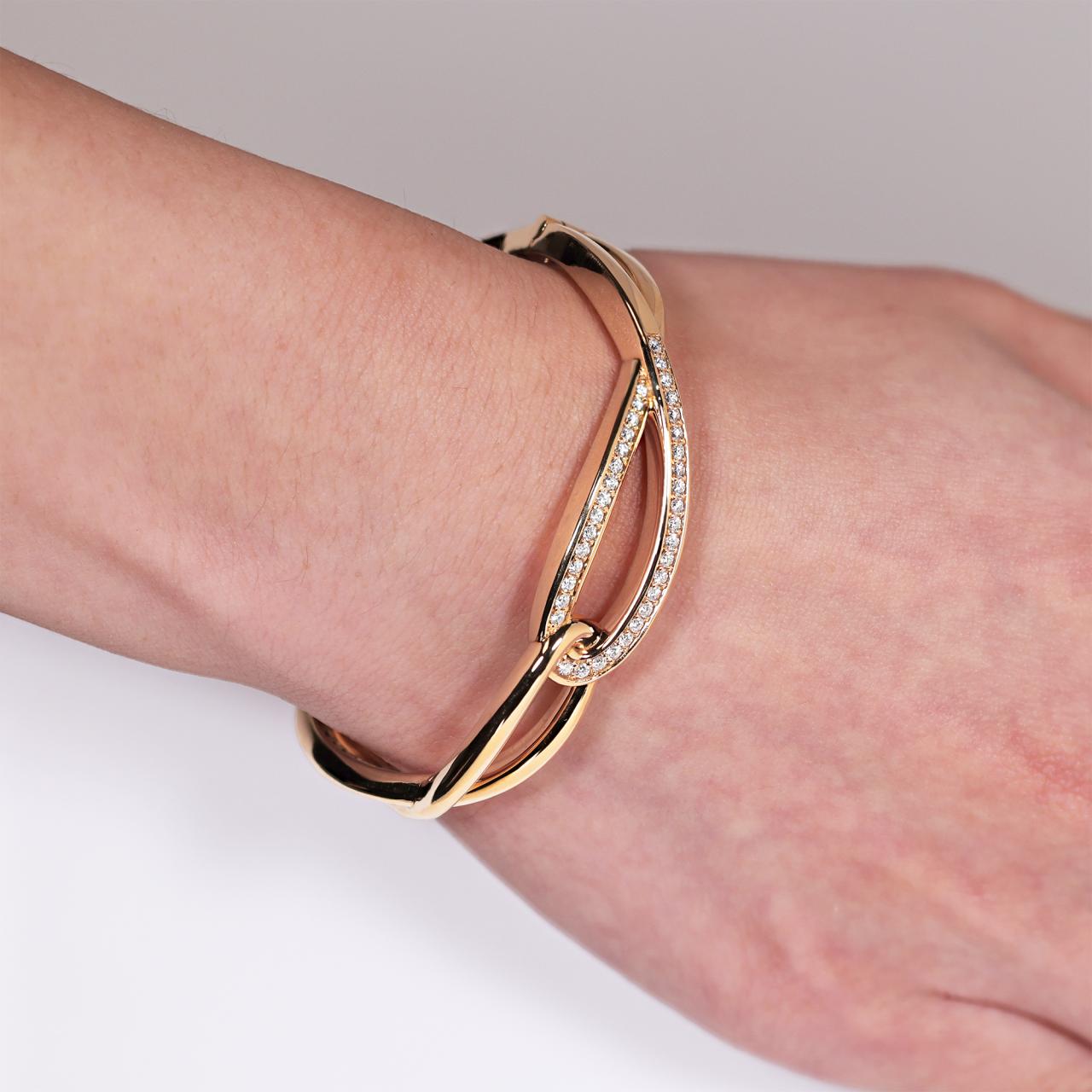 18ct rose gold diamond set hinged bangle on the wrist