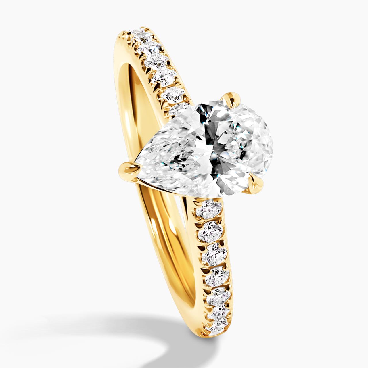 COMO - 18ct yellow gold pear shaped diamond engagement ring in a three claw setting with diamonds on the band. GIA Cert