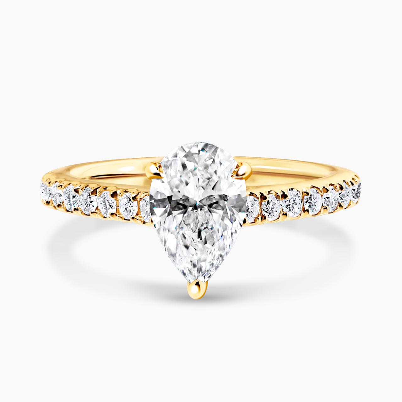 COMO - 18ct yellow gold pear shaped diamond engagement ring in a three claw setting with diamonds on the band. GIA Cert