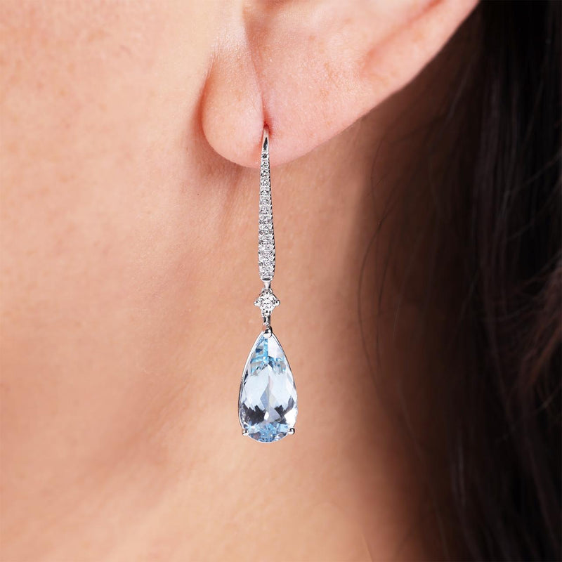 18ct white gold pear shape aquamarine and diamond hook earrings on the ear