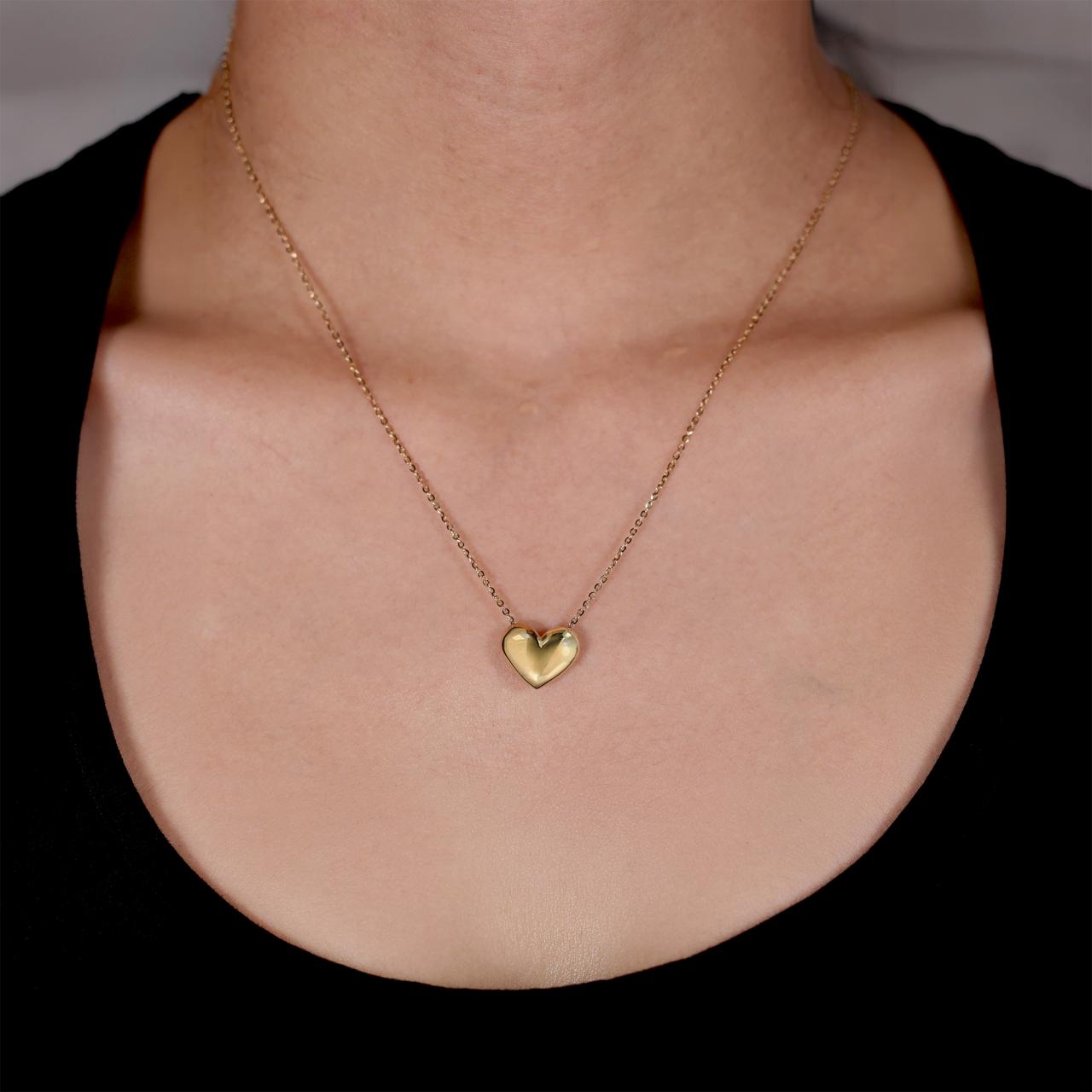 18ct yellow gold hollow heart necklace on the neck