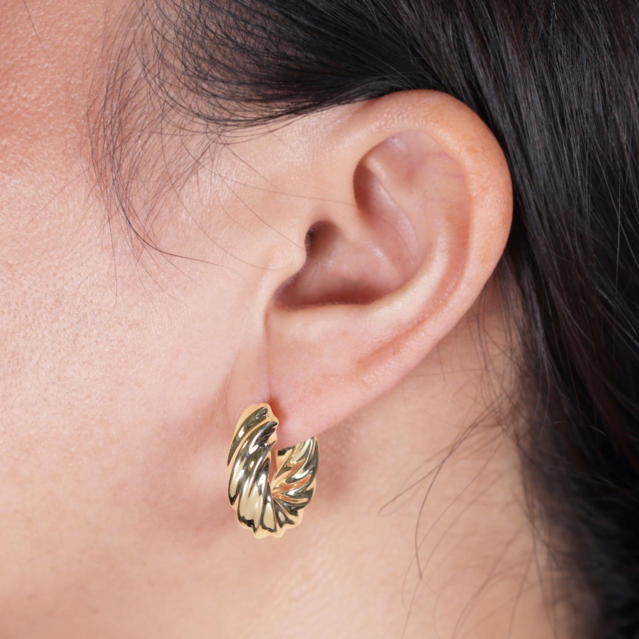 18ct yellow gold hollow chunky hoop earrings on the ear