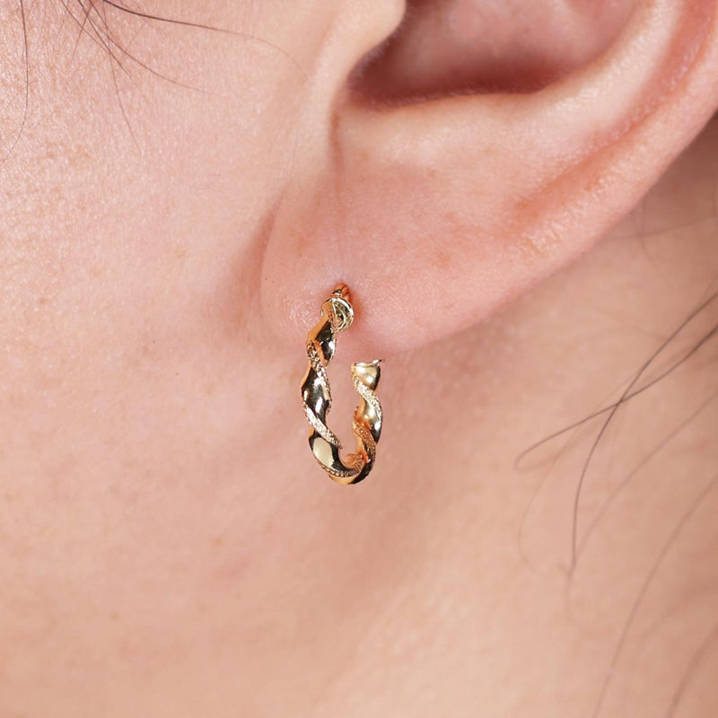 18ct yellow gold hollow plait small hoop earrings on the ear