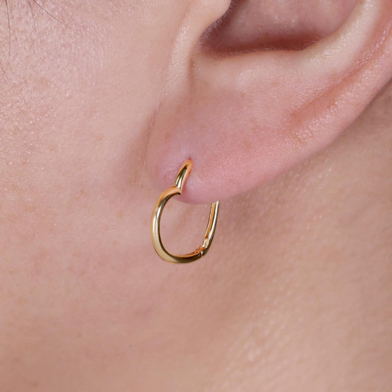 18ct yellow gold heart shape sideways huggies on the ear