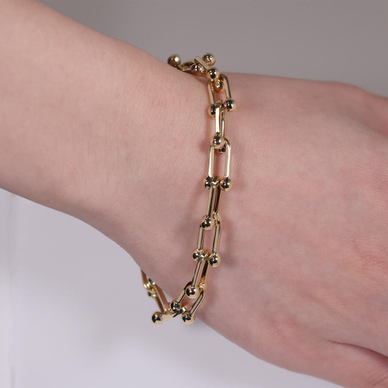 18ct yellow gold fancy link bracelet with lobster clasp on the wrist
