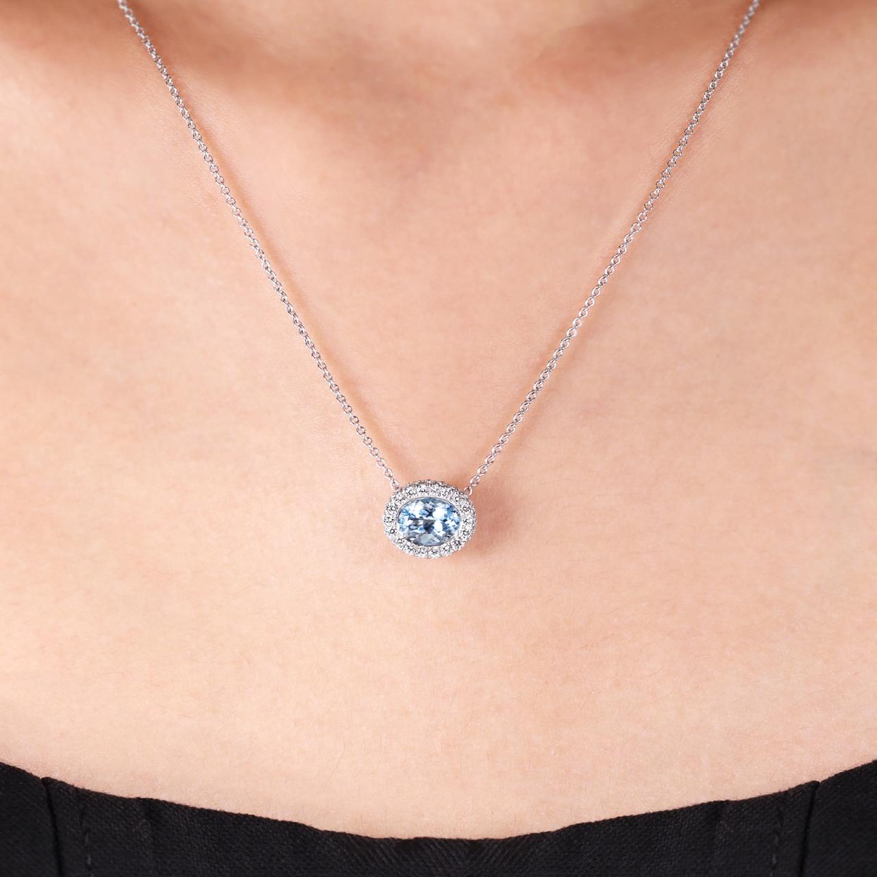 18ct white gold oval aquamarine and diamond necklace on the neck