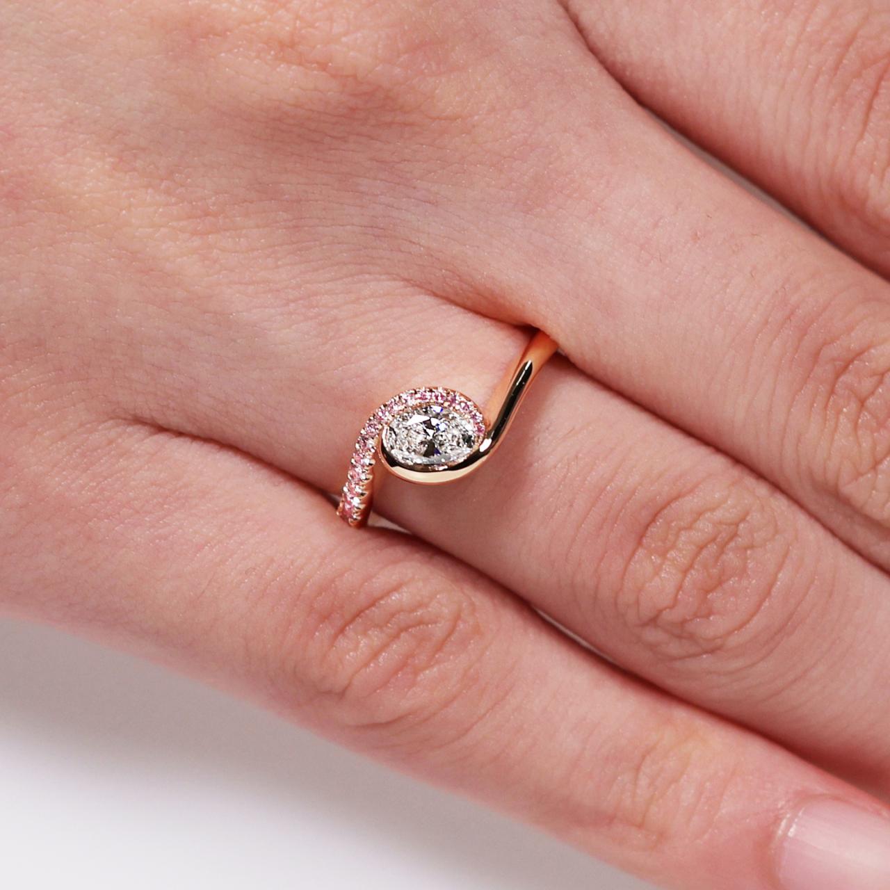 18ct rose gold oval brilliant cut diamond ring with Argyle RBC diamond band