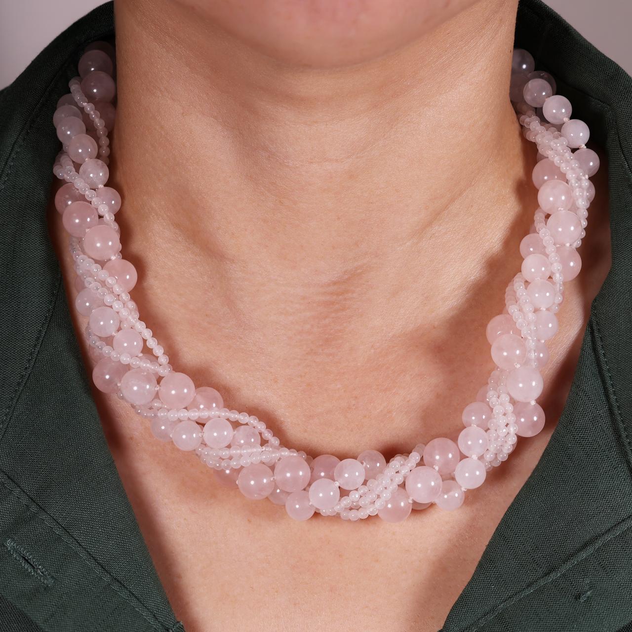Rose quartz six row necklace ended with a gold plated silver magnetic clasp from the Carmela Cerrone Collection on the neck