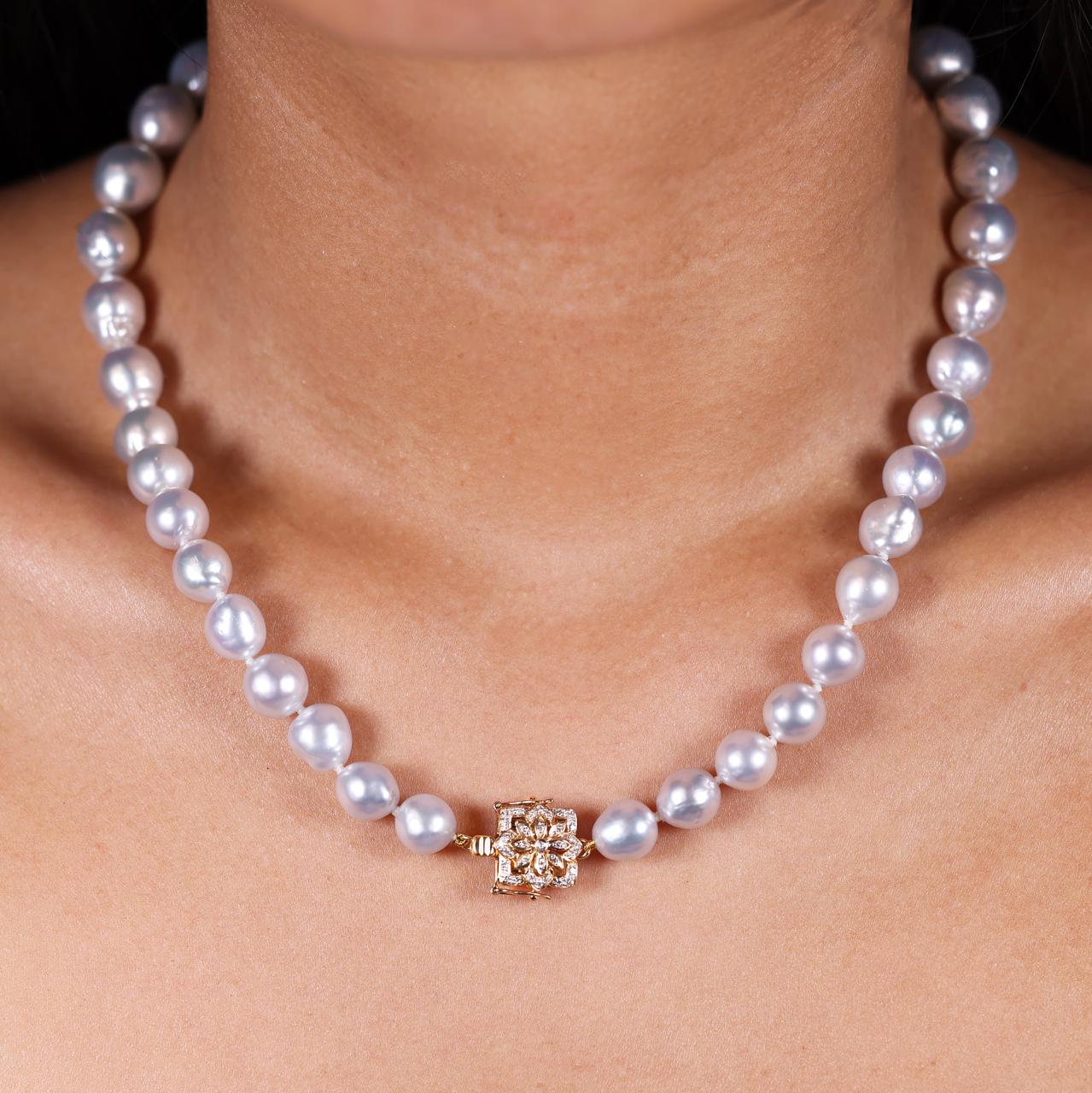 9-12mm South sea pearls necklace ended with a 18ct yellow gold diamond clasp from the Carmela Cerrone Collection on the neck