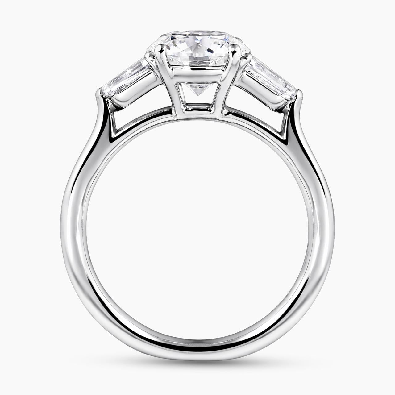 Platinum 1.50ct round brilliant cut diamond ring featuring 2=0.59ct bullet diamonds in a claw setting