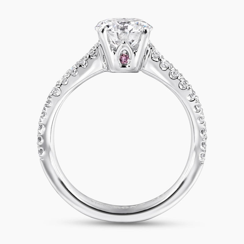 18ct white gold round brilliant cut diamond ring featuring round fancy pink diamonds side profile