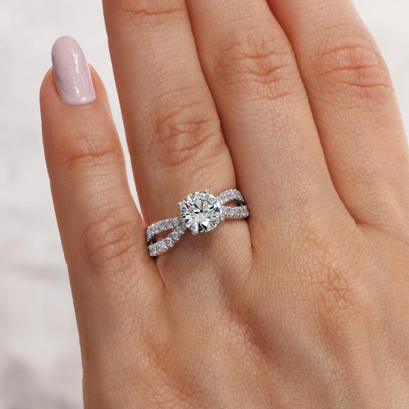 18ct white gold round brilliant cut diamond ring featuring round fancy pink diamonds on finger