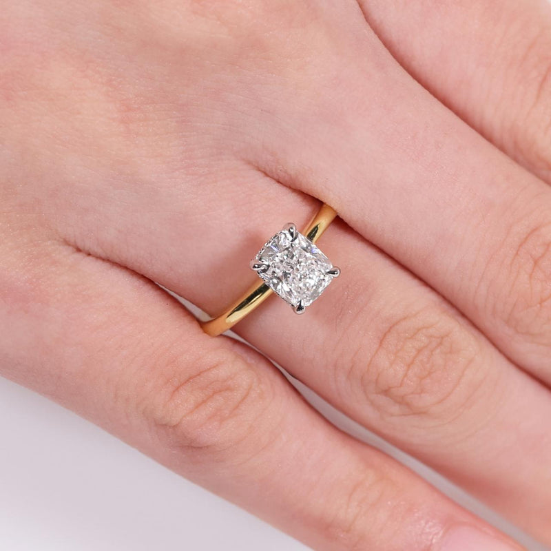 18ct yellow and white gold Cushion cut diamond ring with hidden halo on finger
