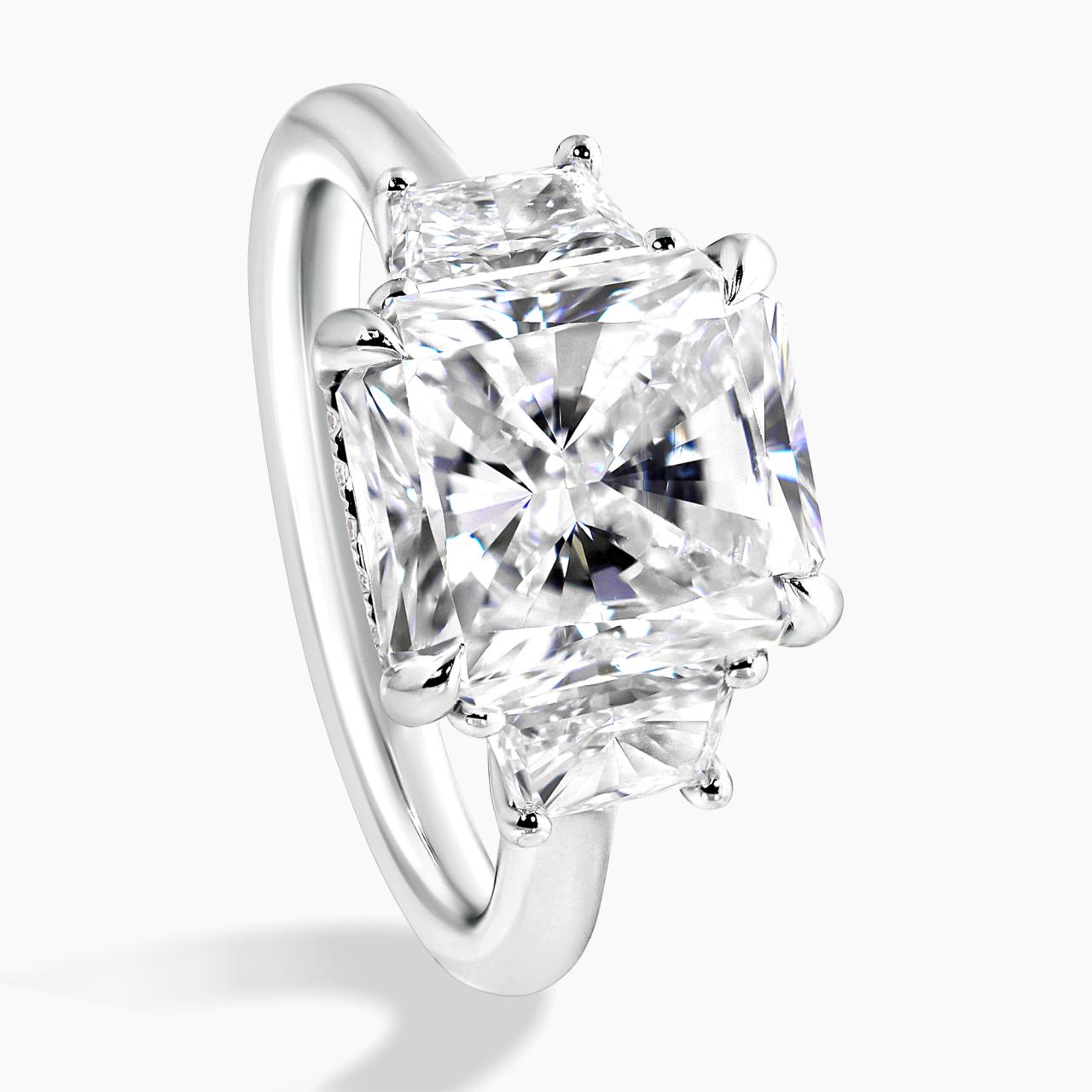 Platinum 5.03ct radiant diamond ring with 2=0.73ct trapezoid brilliant cut diamonds on the sides side profile