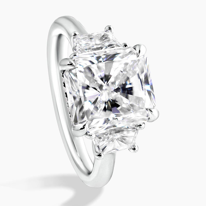 Platinum 5.03ct radiant diamond ring with 2=0.73ct trapezoid brilliant cut diamonds on the sides side profile