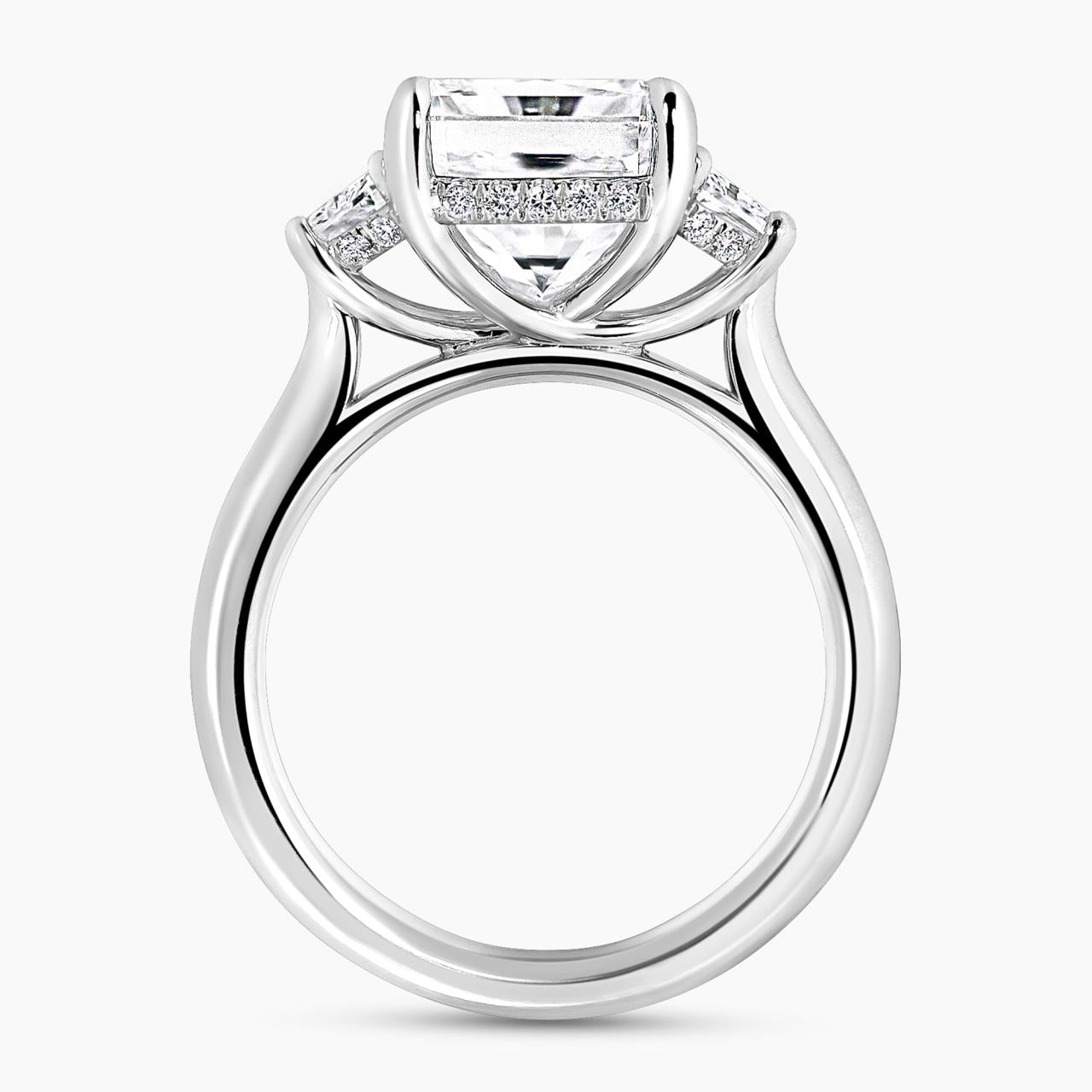 Platinum 5.03ct radiant diamond ring with 2=0.73ct trapezoid brilliant cut diamonds on the side. Side view