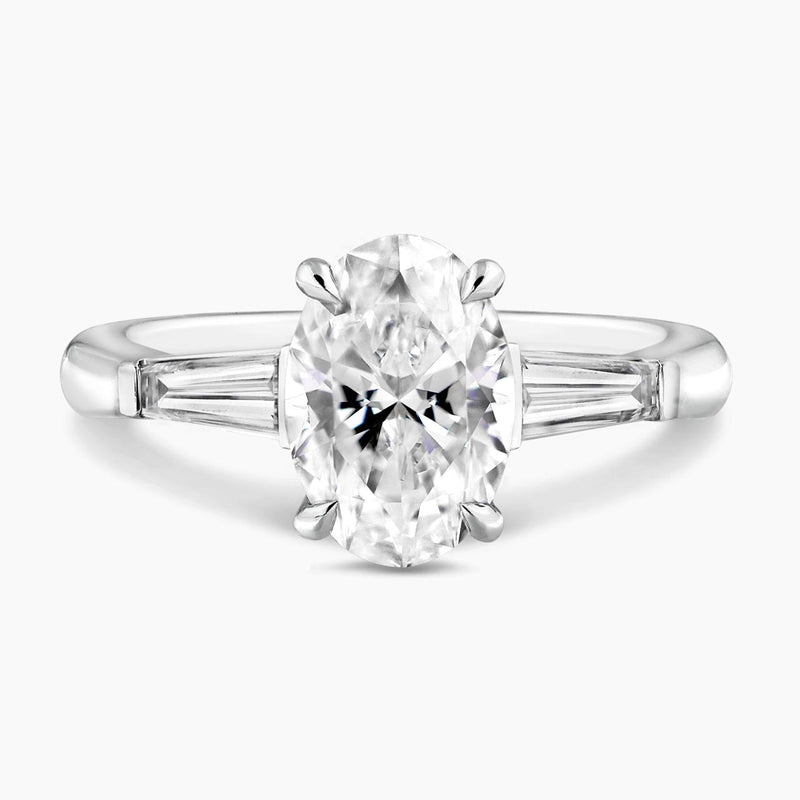 18ct white gold 1.80ct oval brilliant cut diamond ring features 2=0.46ct tapered baguette diamonds 