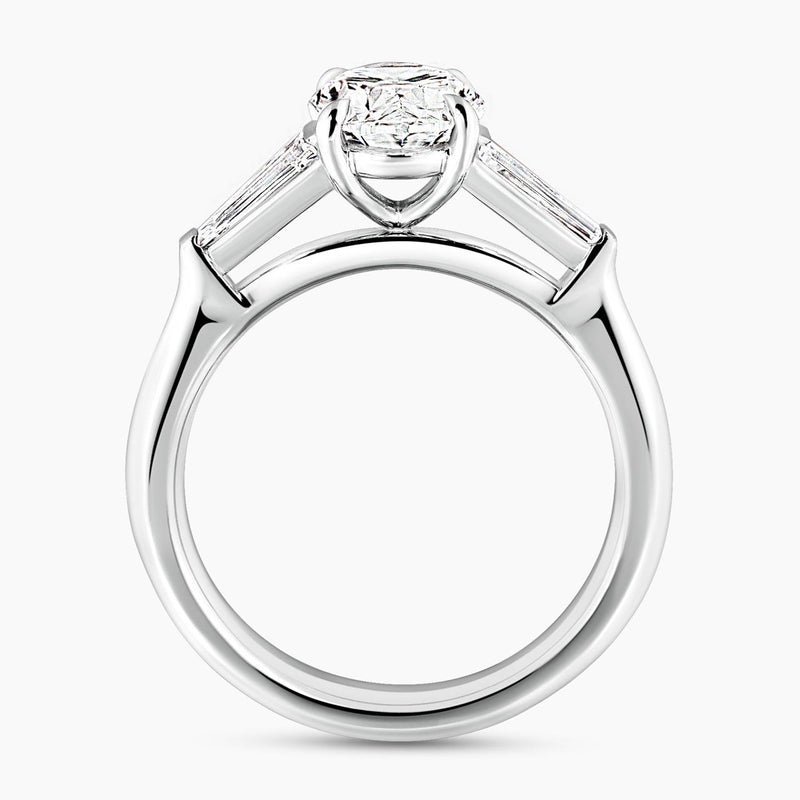 18ct white gold 1.80ct oval brilliant cut diamond ring features 2=0.46ct tapered baguette diamonds side profile