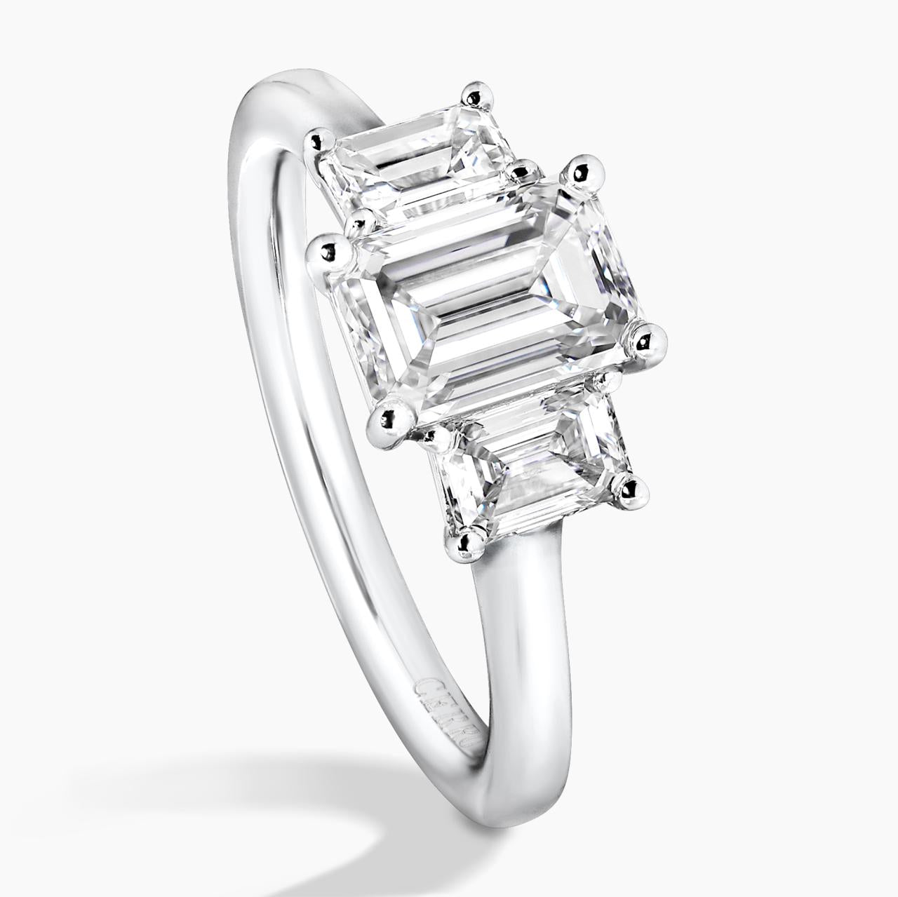 18ct white gold 1.20ct and 2=0.70ct emerald cut diamonds ring in a four claw setting GIA Cert side profile