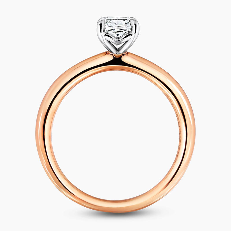 18ct rose gold 0.83ct cushion cut diamond solitaire ring in a four claw setting side profile