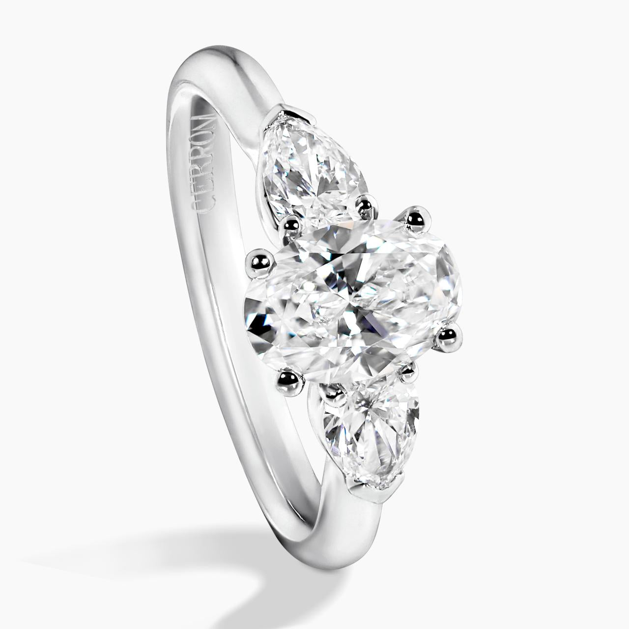 18ct white gold 1.20ct oval brilliant cut diamond and 2=0.60ct pear shaped diamonds ring side profile