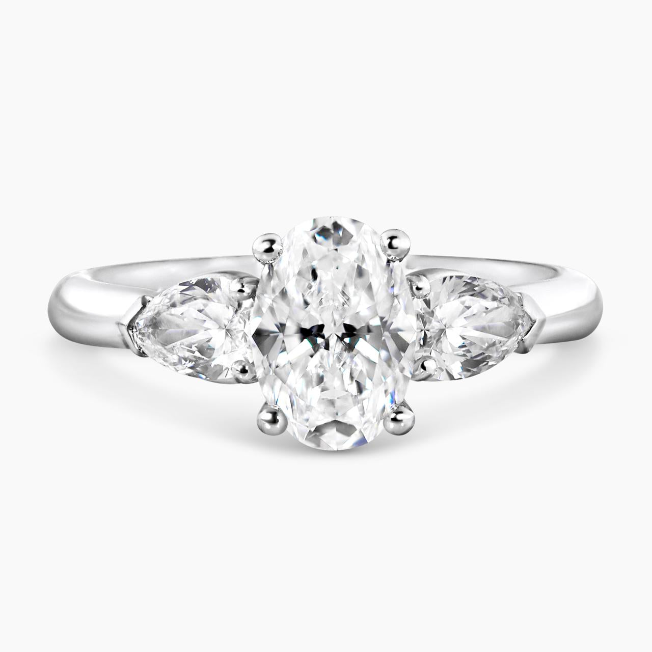 18ct white gold 1.20ct oval brilliant cut diamond and 2=0.60ct pear shaped diamonds ring