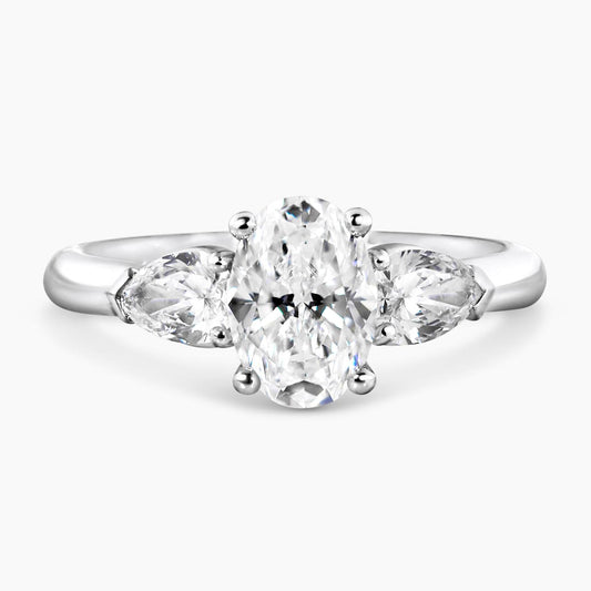18ct white gold 1.20ct oval brilliant cut diamond and 2=0.60ct pear shaped diamonds ring