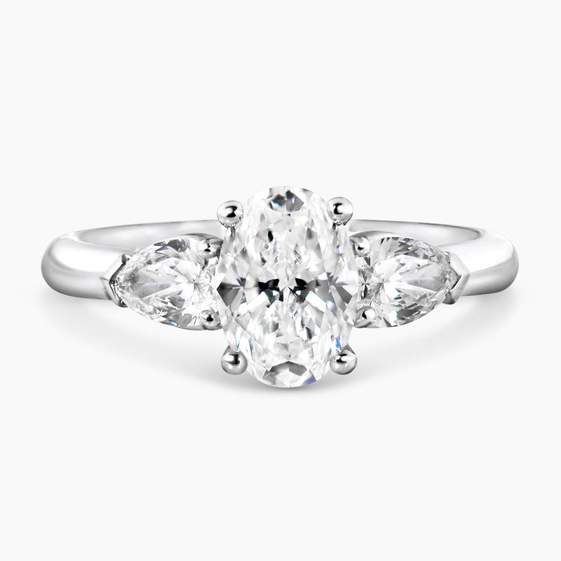 18ct white gold 1.20ct oval brilliant cut diamond and 2=0.60ct pear shaped diamonds ring