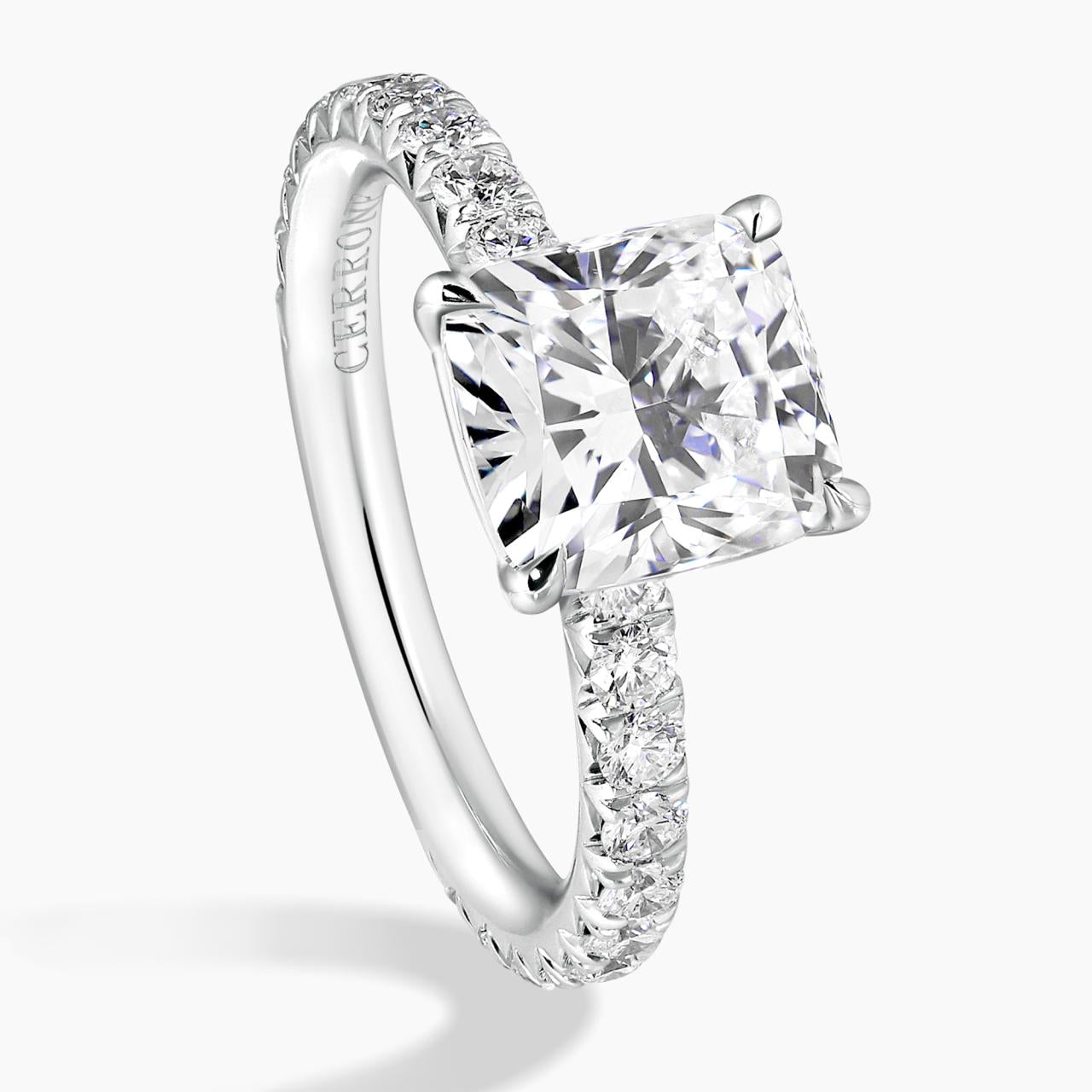 18ct white gold 2.02ct cushion cut diamond ring in a four claw setting with diamond band side view