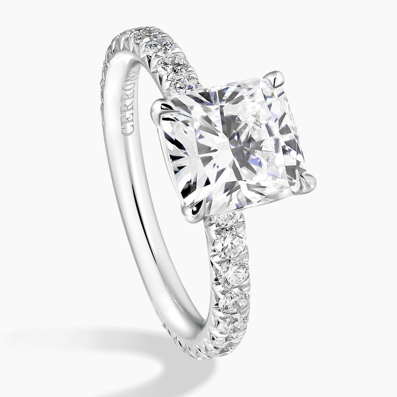 18ct white gold 2.02ct cushion cut diamond ring in a four claw setting with diamond band side view