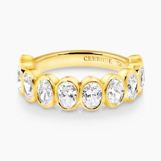 18ct yellow gold oval brilliant cut diamonds ring in a bezel setting