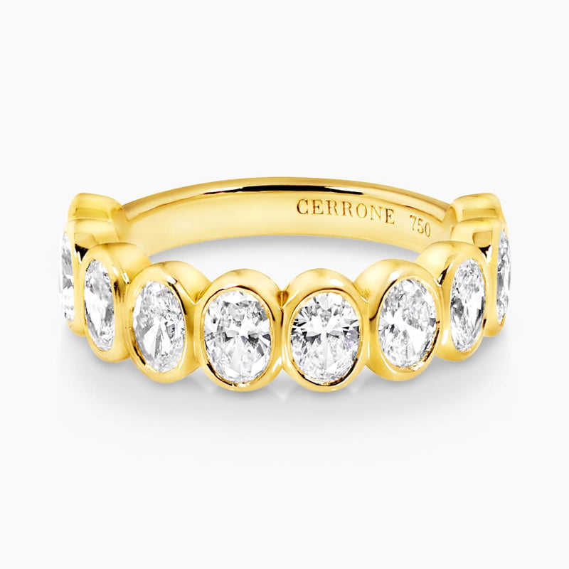 18ct yellow gold oval brilliant cut diamonds ring in a bezel setting
