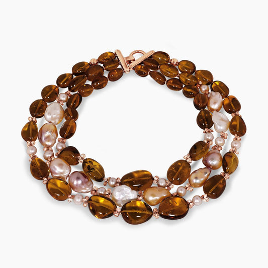 Baroque freshwater pearls, amber and topaz beads necklace with gold-plated silver fittings from the Carmela Cerrone Collection on a white background