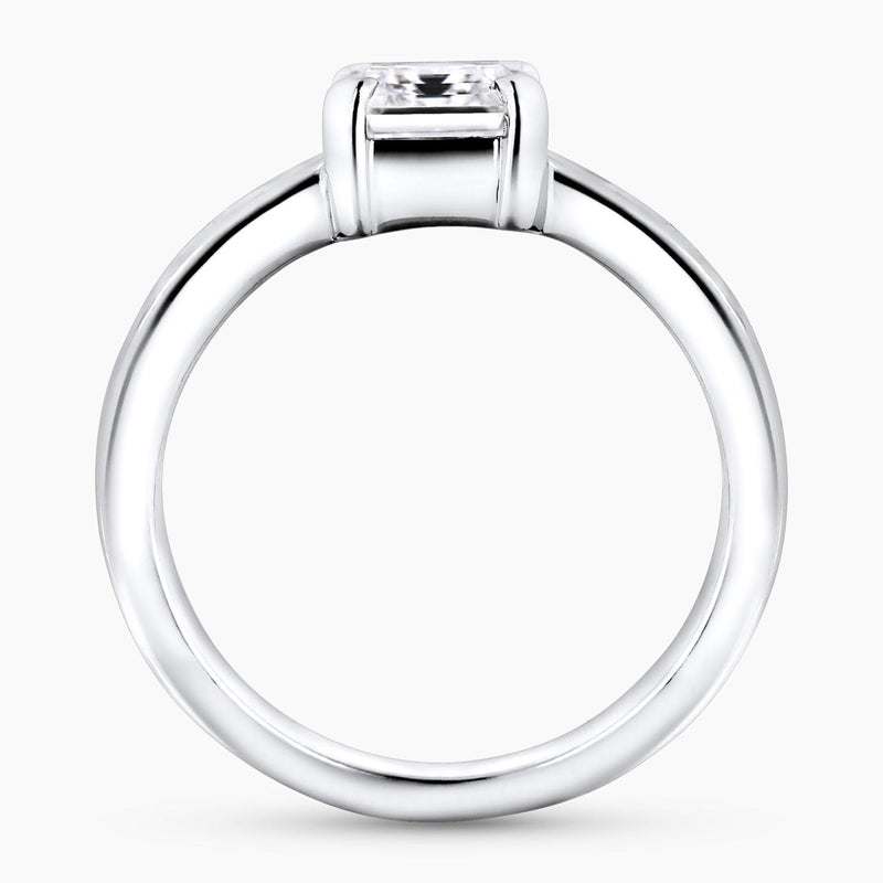 18ct White gold emerald cut diamond engagement ring with baguette cut diamonds on the band side profile